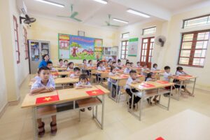 Bright classroom with children ready to learn, showcasing vibrant decor and attentive students.