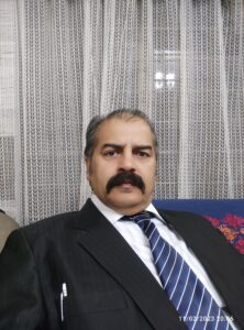 Ch. Nadeem Rashid, CEO of City Tutors Academy, sitting in office in formal attire, representing leadership and commitment to academic excellence.